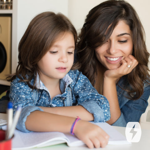 A mom reads with her daughter