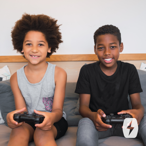 Two kids using video game controllers