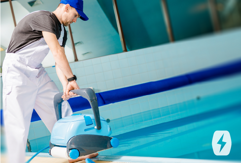 A man cleans a pool