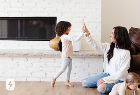 A woman and child high five