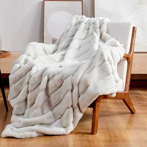 Silver furry blanket draped over chair