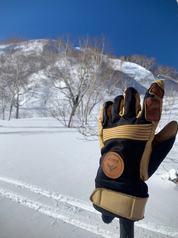 A Baist ski glove against a snowy backdrop, emphasizing the glove's insulation and weather-resistant features, perfect for winter sports and outdoor activities in frosty conditions.