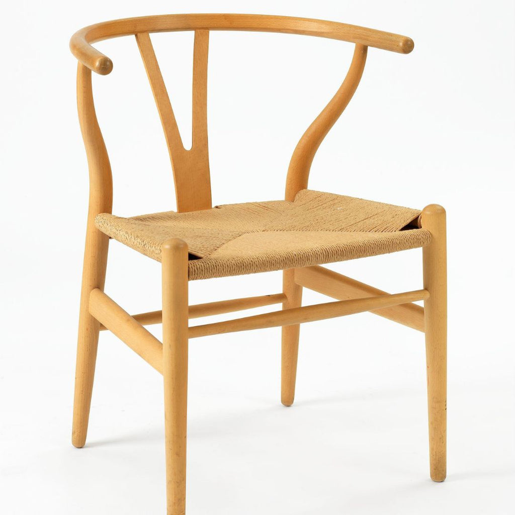 Hans Wegner's Wishbone Chair (1949). Armchair designed by Hans Wegner, manufactured by Carl Hansen & Søn Møbelfabrikk in 1950. Made of beechwood