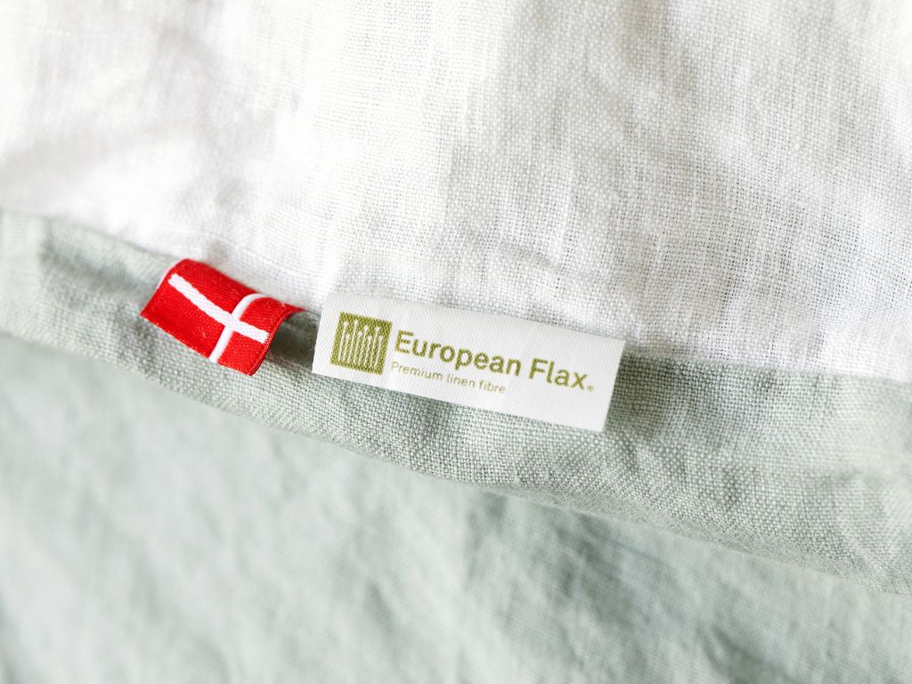 Linen bedding with Danish flag and European Flax certification label