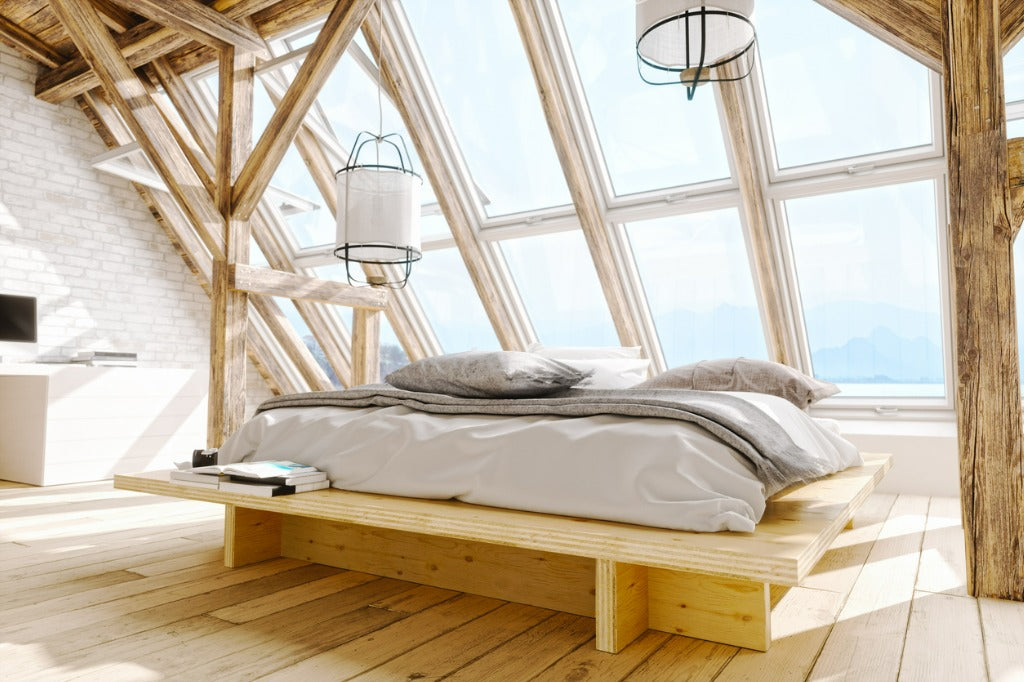 Interior of a Scandinavian style attic bedroom with beautiful sea and mountain view