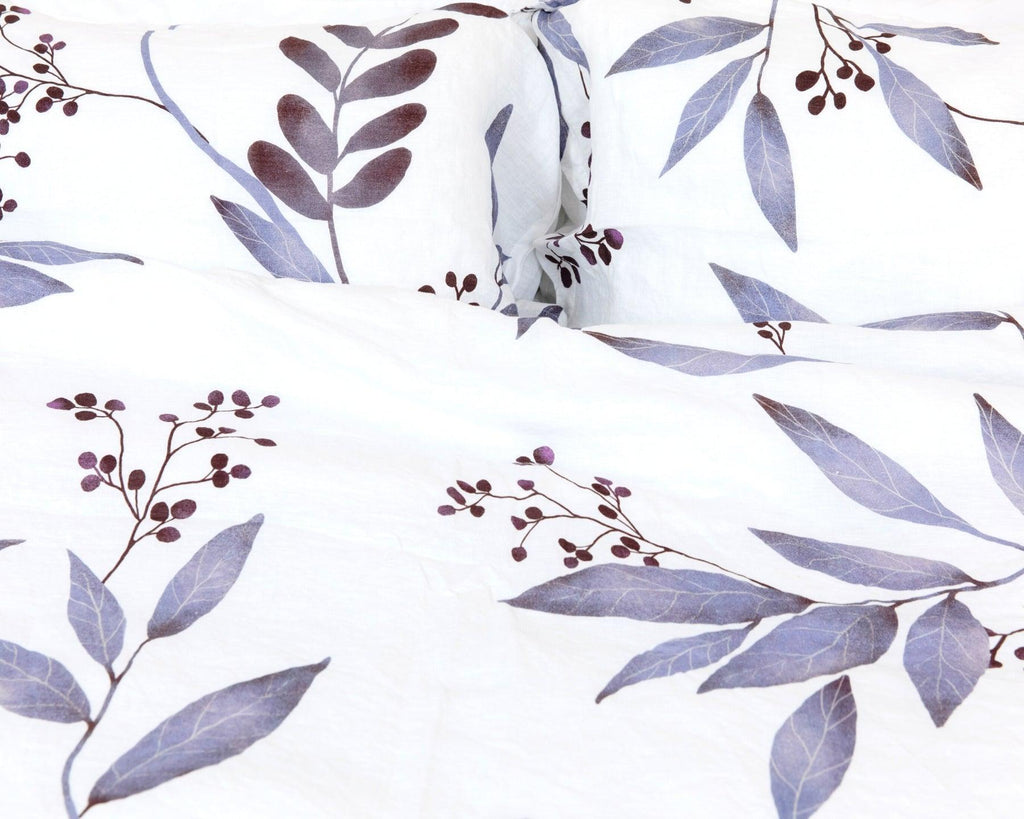 Organic European linen duvet cover set in modern Scandinavian design featuring purple leaves