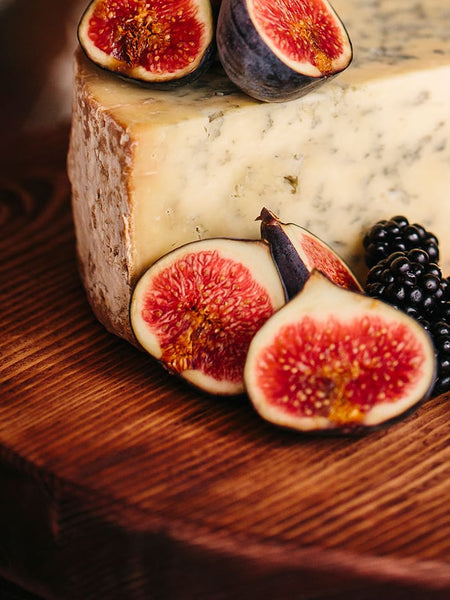 Fruit and cheese board using Prop Options rustic olive boards