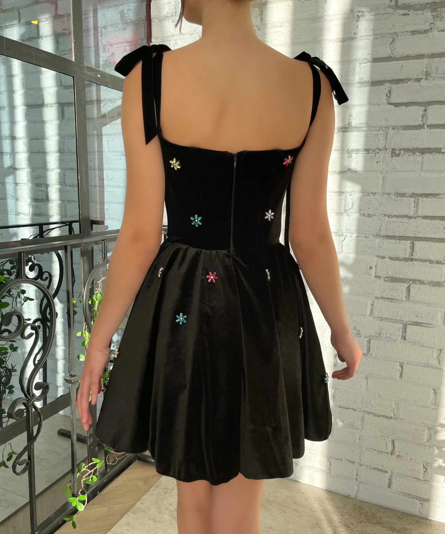 Black mini dress with bow straps and embroidery