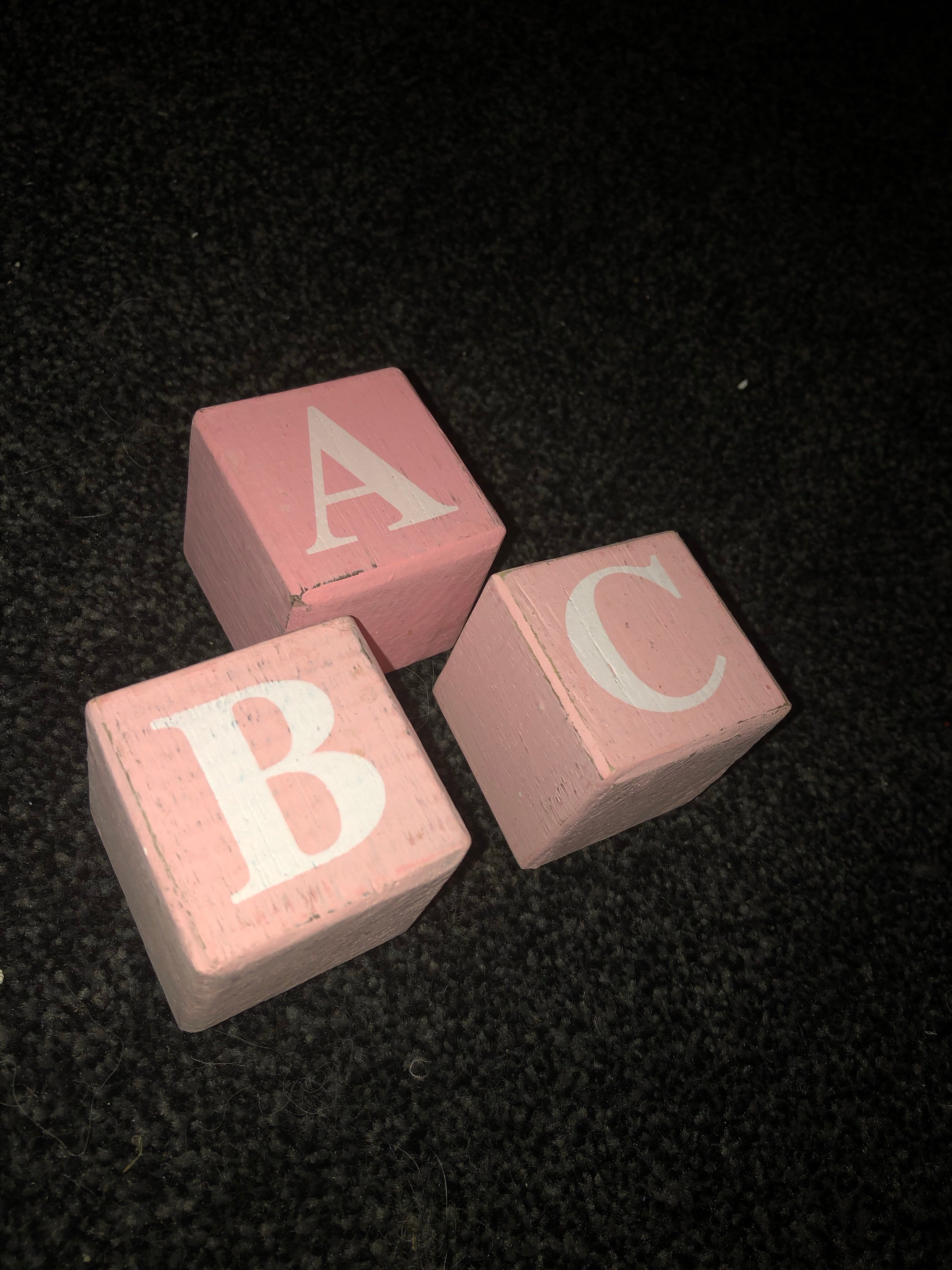 pink wooden alphabet blocks