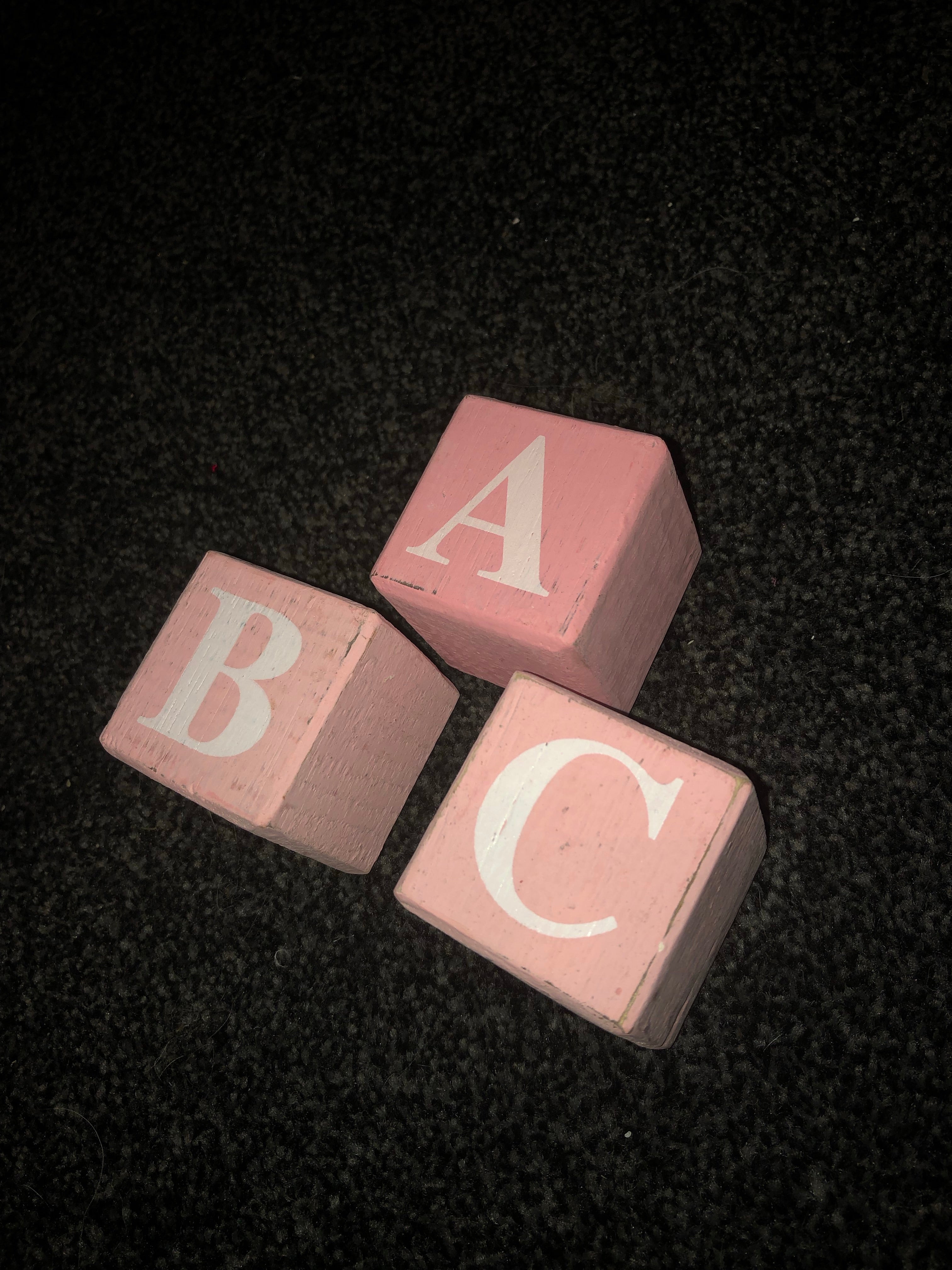 pink wooden alphabet blocks