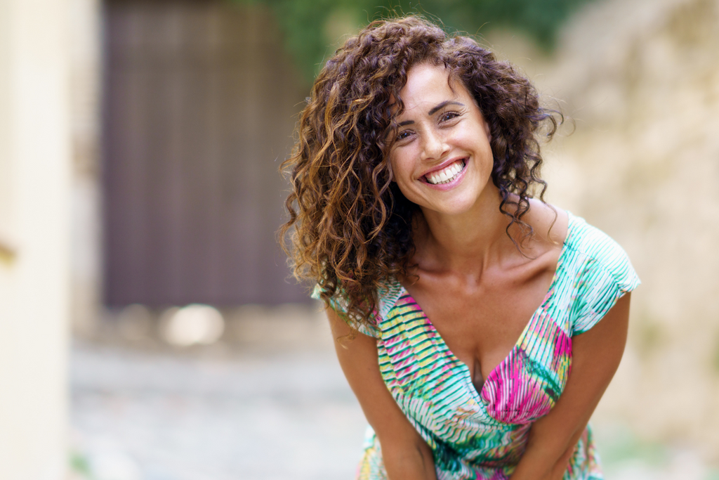 Woman in Sun Dress with Curly Hair