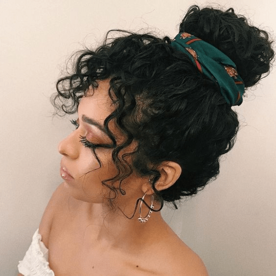 woman with natural hair in a bun