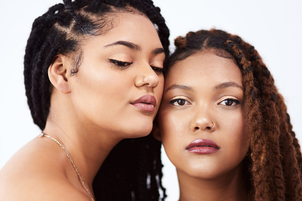 Two beautiful women modeling box braids