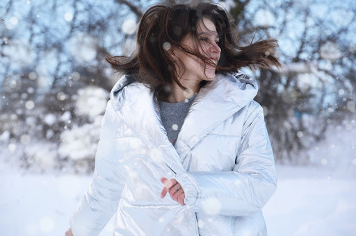 woman with long hair in a parka 