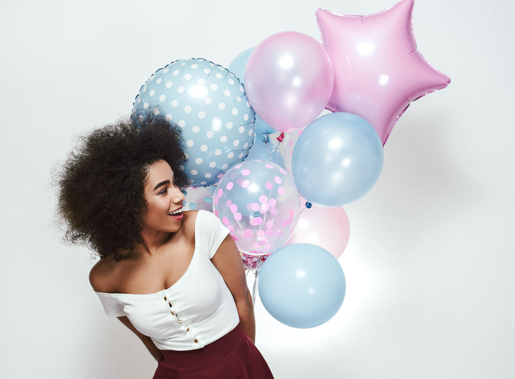 curly hair girl with balloons