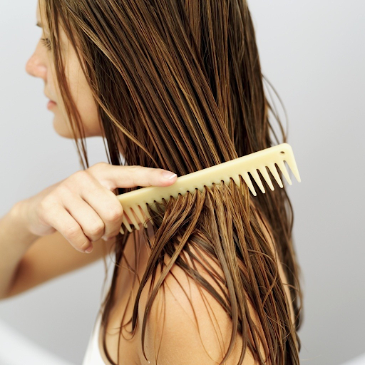 woman combing her hair