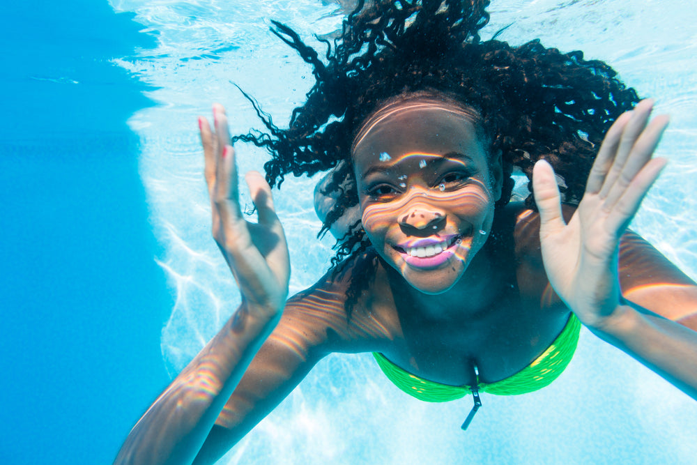 Curly Haired Woman Underwater Swimming and Smiling | Prevent Swimmers Hair | RevAir