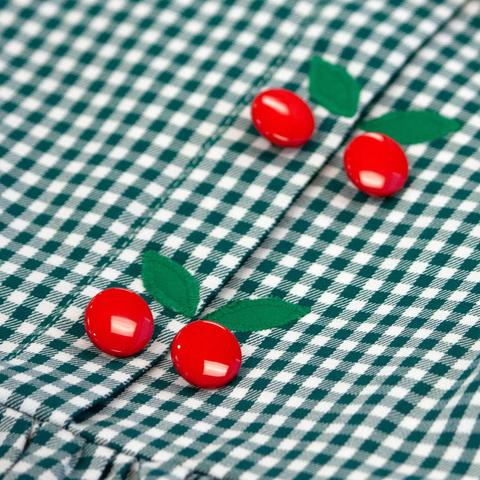 detail of our red cherry buttons and leaf appliqués