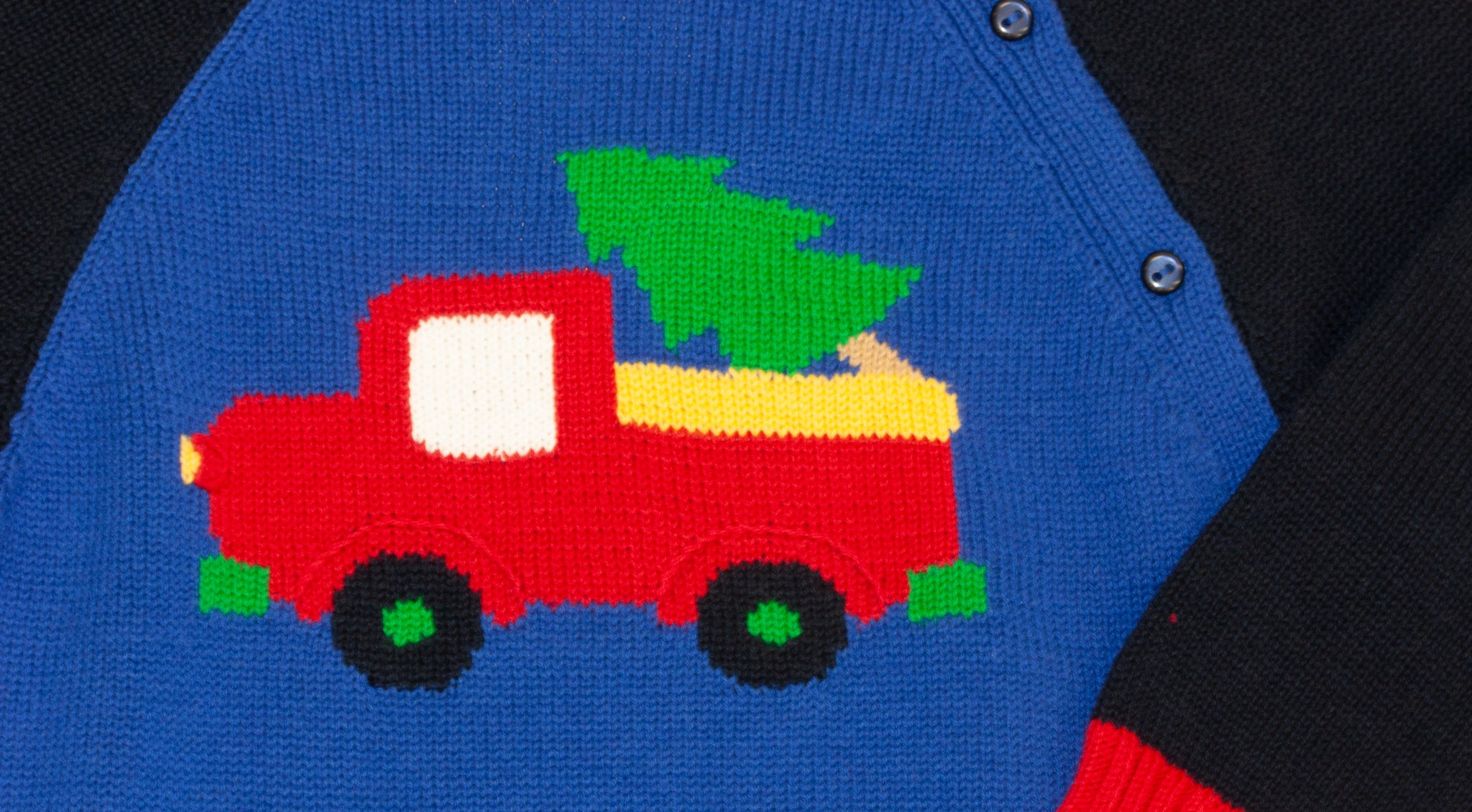 detail of boy's sweater with truck