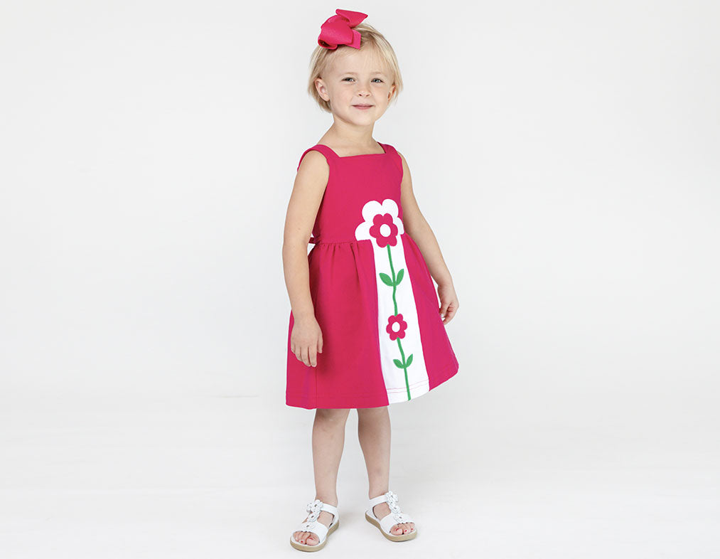 young girl in pink floral dress