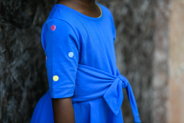 Blue front-tie dress with embroidered polka dots