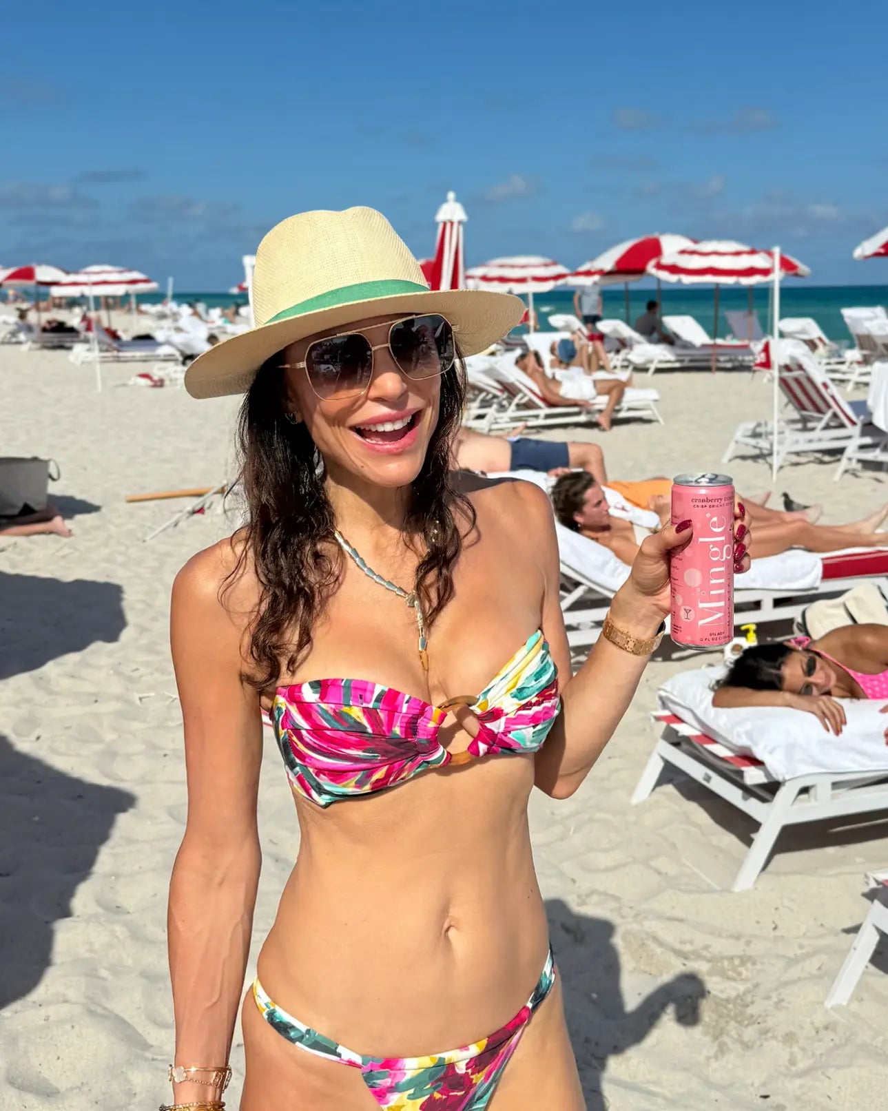 Bethenny Frankel enjoying a Cranberry Cosmo Mocktail by Mingle Mocktails on the beach