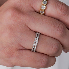 Pratima Sethi styles the Scallop and Isabella White Diamond Bands as solo bands that can build into a wedding set ring stack