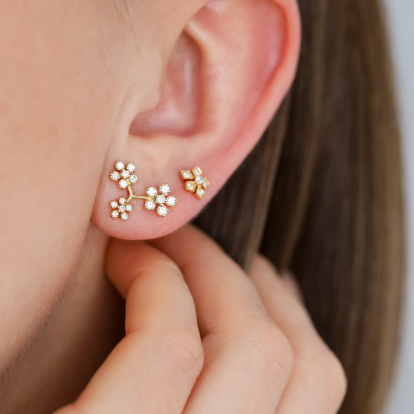 Model wears the Enchanted Garden Triple Flower White Diamond Studs paired with the Enchanted Garden White Diamond Studs