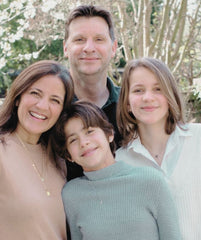 Family photo of Pratima Sethi with her husband and their two daughters