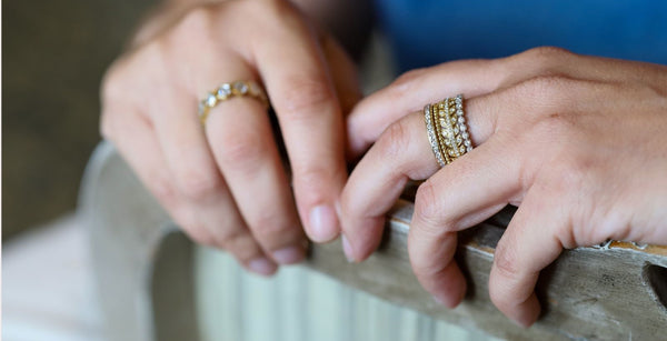 Pratima Sethi's stacking rings, including the Bezel White Diamond Band, the Wreath White Diamond Band, and Channel White Diamond Band