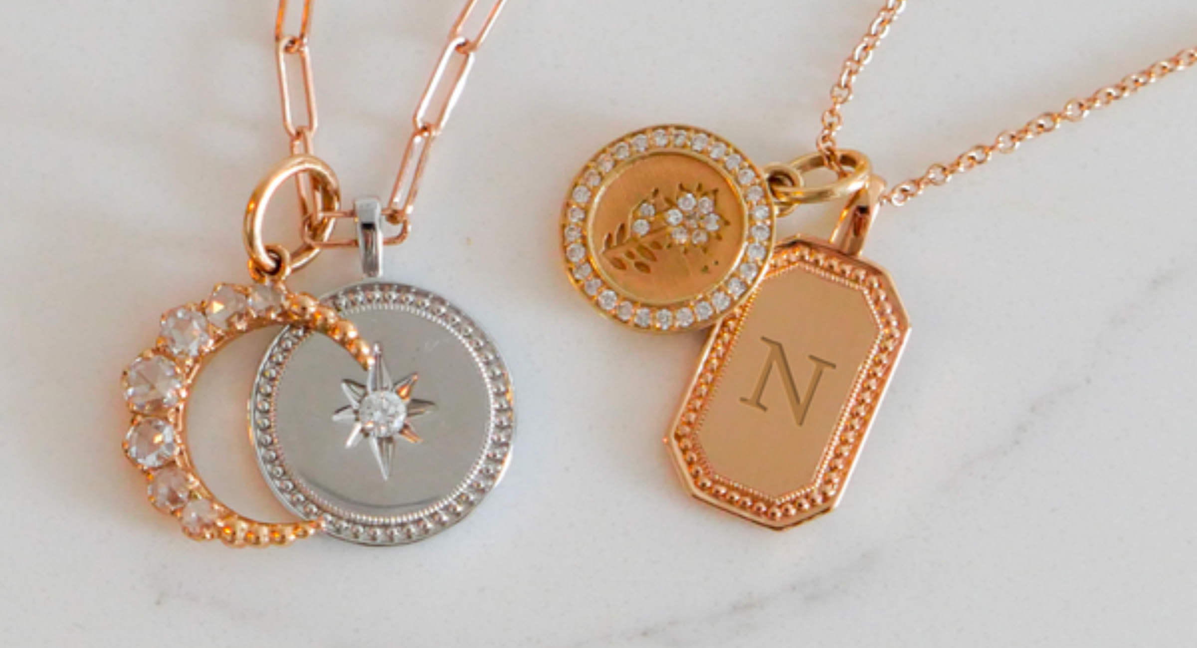 Assortment of pendants and charms in mixed 18K yellow and rose gold