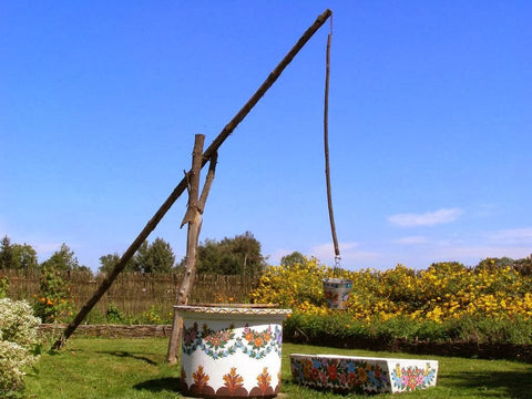 water well crane type painted in flowery patterns