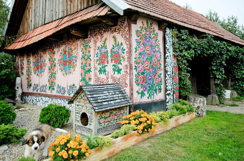 barn and dog house painted with floral motives