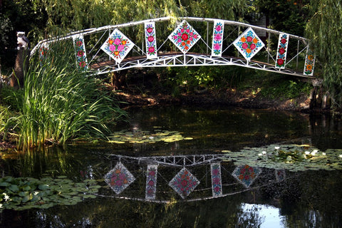 side of the bridge wall painted in flowery pattern