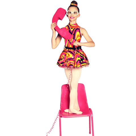 Dancer standing on a pink chair holding a large pink foam phone