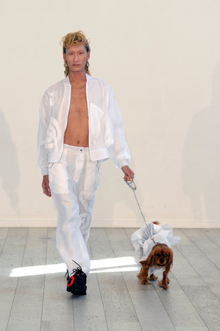 Lula Laora ss22 the garden Getty runway, white organza bomber jacket, white trousers, matching white organza dog jacket. 