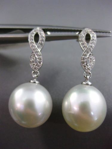 ESTATE .15CT DIAMOND & AAA PEARL 14KT WHITE GOLD INFINITY LOVE HANGING EARRINGS