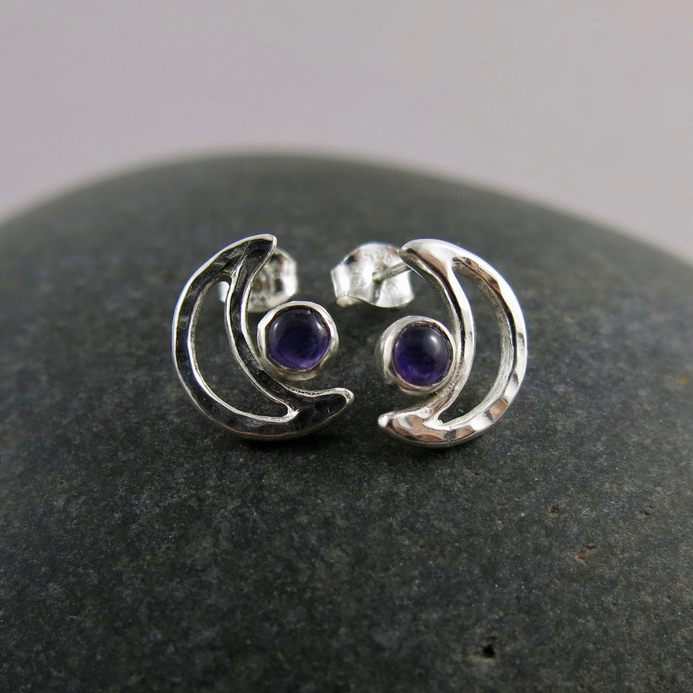 Handcrafted sterling silver crescent moon studs with amethyst by Mikel Grant Jewellery.