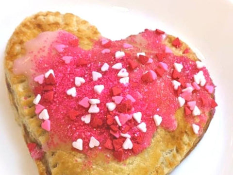 Strawberry Homemade pop tarts with icing and sprinkles