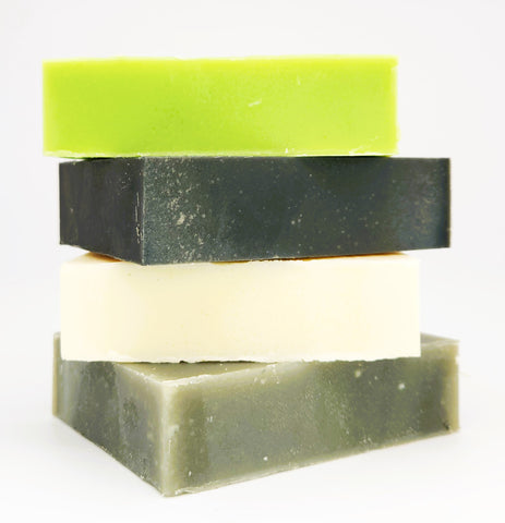 Image of Green Theory Naturals soap and shamppo bars stacked on top of eachother with a white background