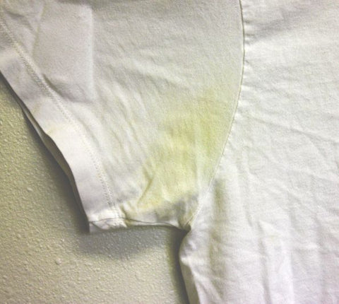 photo of yellow stains in the armpit of a white tshirt