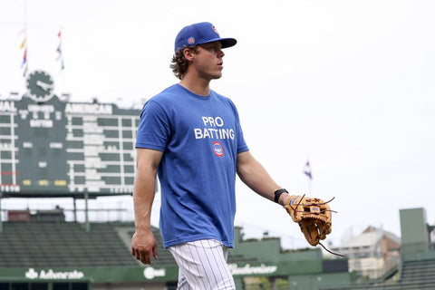 Cubs fan behind one-liner shirts