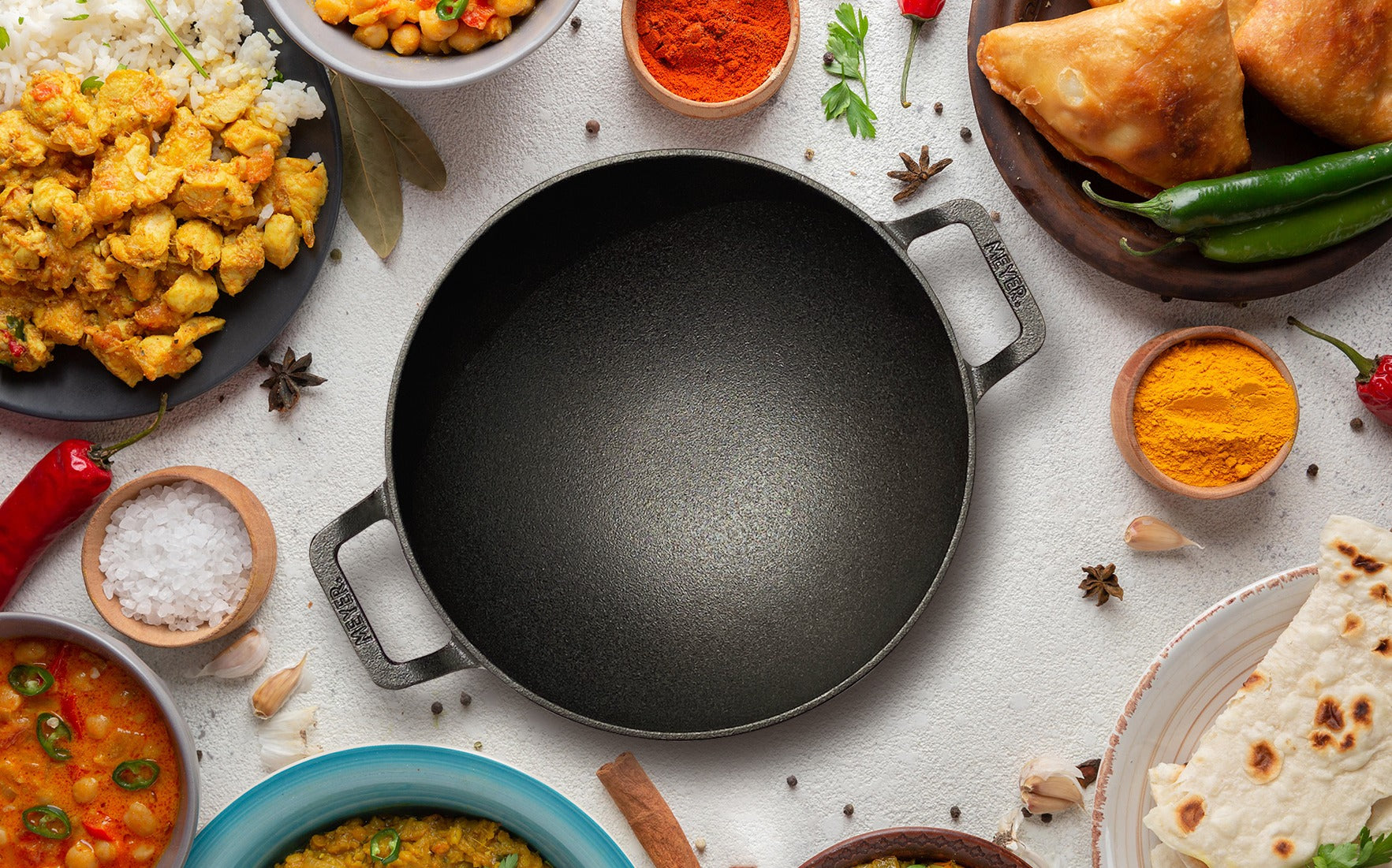 https://cdn.shopify.com/s/files/1/2446/6407/files/Meyer_Pre_Seasoned_Cast_Iron_curved_Kadai_without_Lid2_4_11zon.jpg?v=1682589164