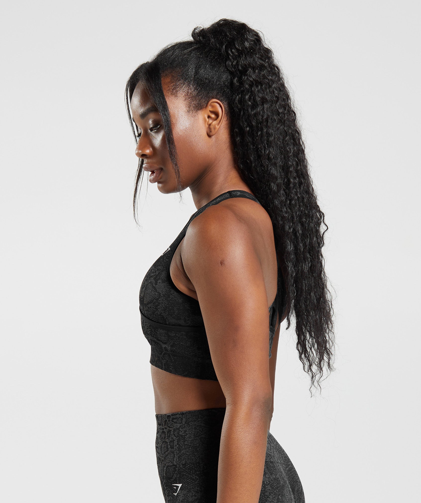 HIIT sports bra with strap detail in blurred animal print