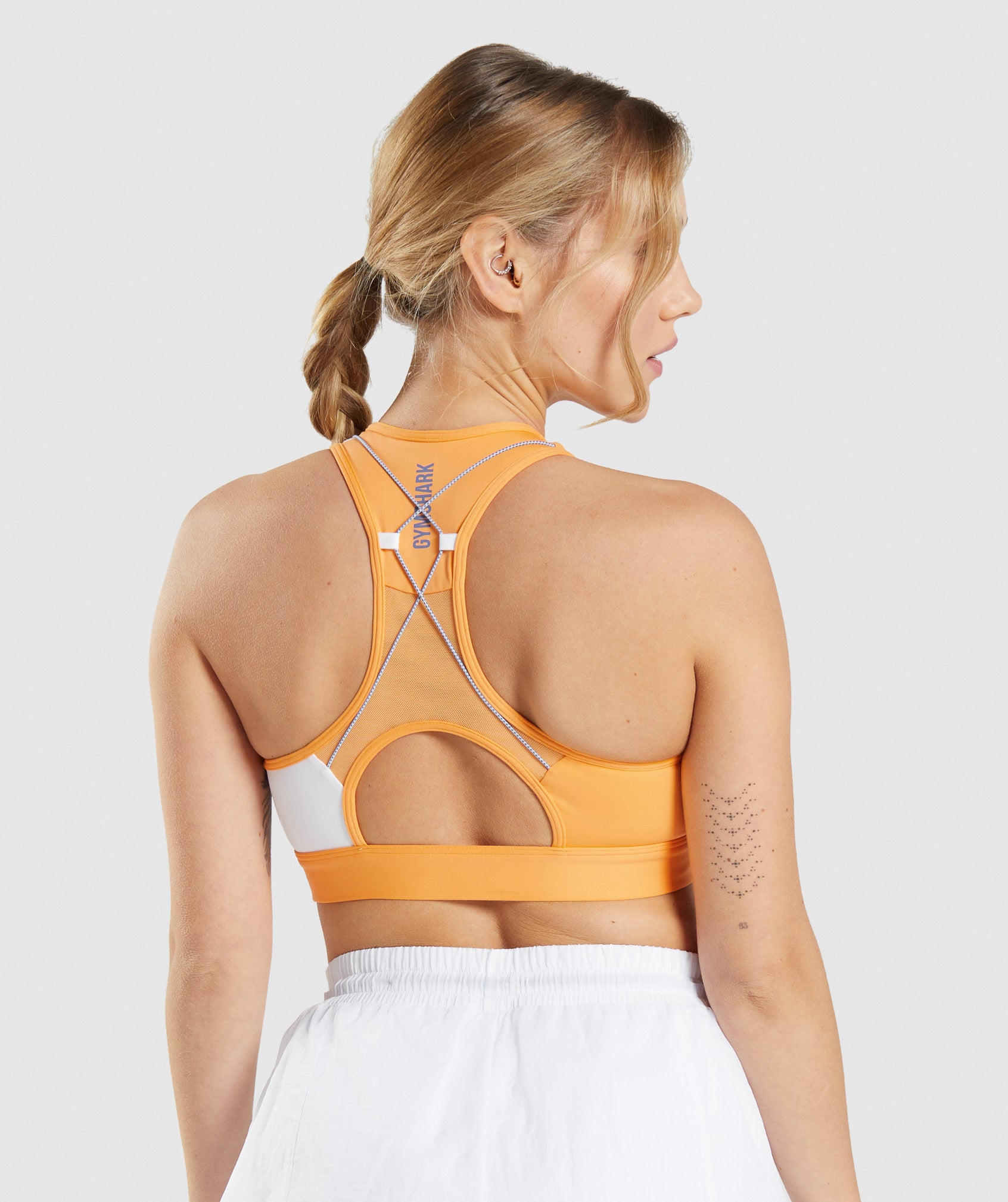 Pulse Sports Bra in Apricot Orange/White