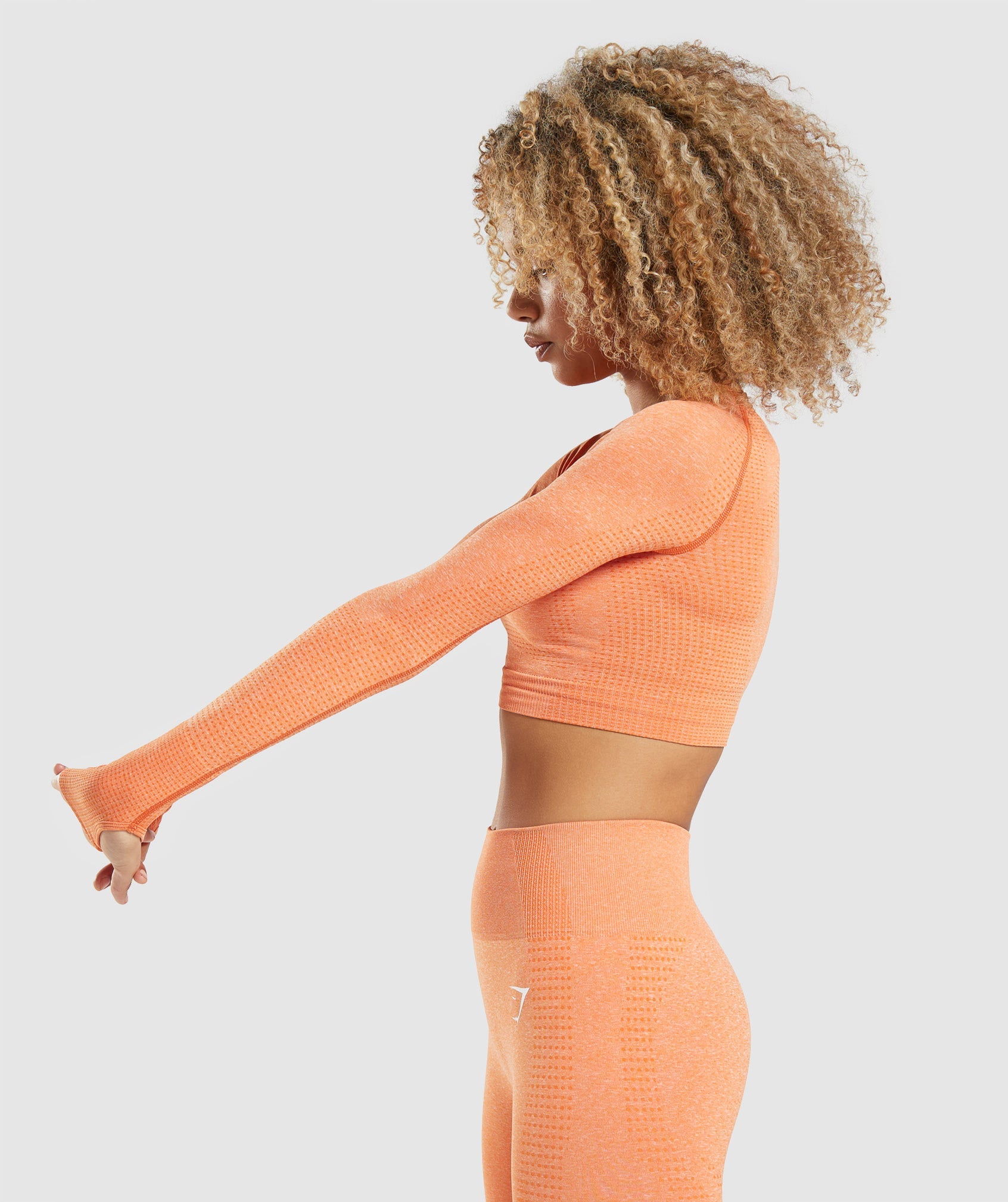 Vital Seamless 2.0 Long Sleeve Crop Top in Apricot Orange Marl - view 3