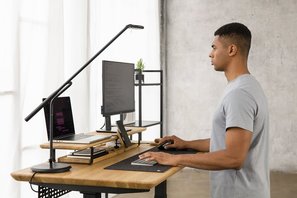 man working standing desk