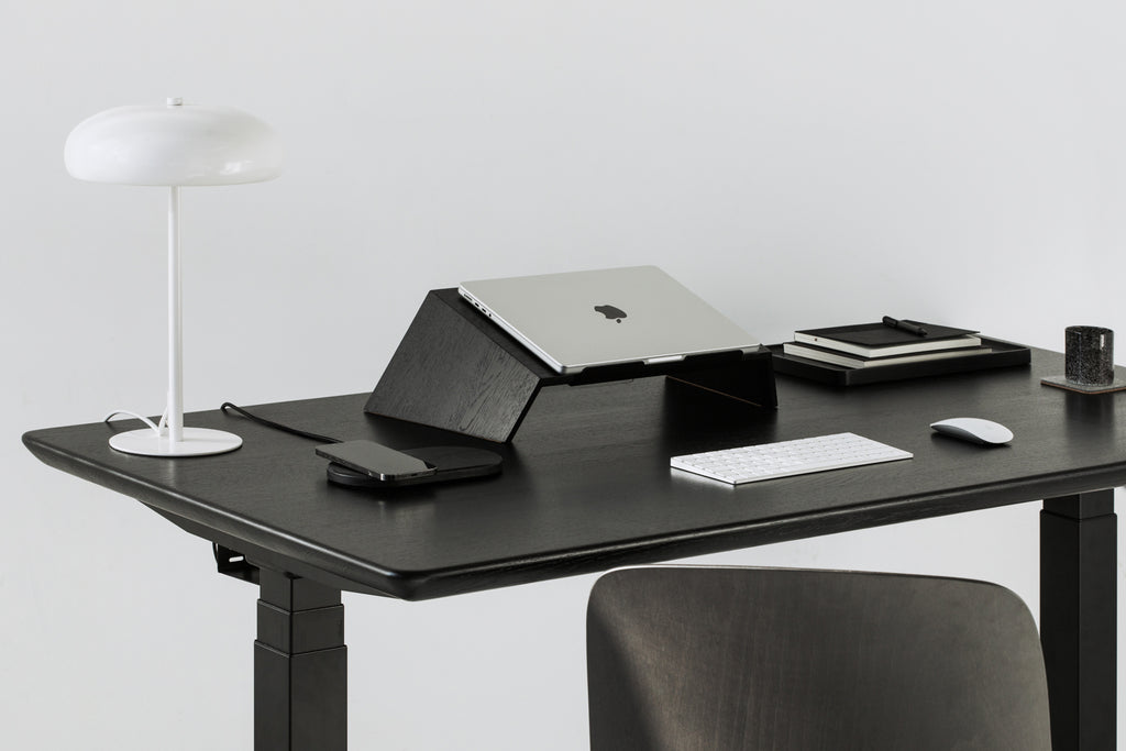 black wooden desk setup