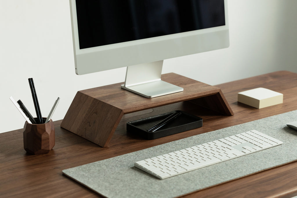 minimal desk setup in walnut