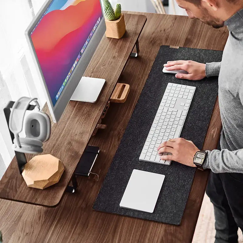 man working on standing desk